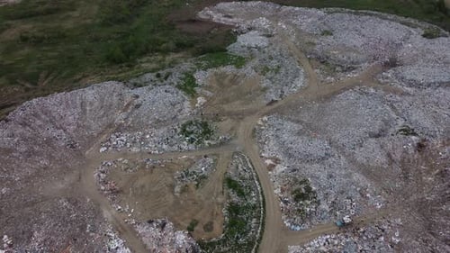 41. Aerial view. Lots of unsorted household waste outdoors.