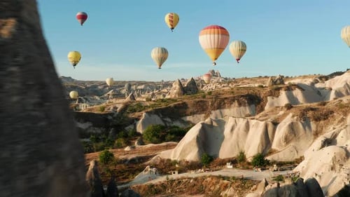 Early morning hot air ballooning at Goreme Cappadocia, Turkey. Dolly in shot using a drone.