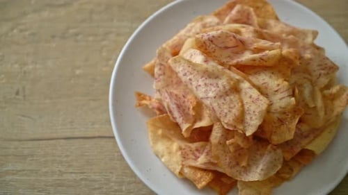 Golden Taro Chips on a White Plate