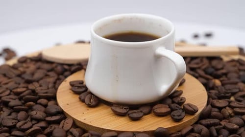 Close Up of Coffee Mug with Coffee Beans