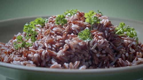 Plate of Cooked Brown Rice with Parsley