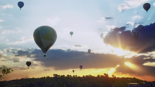 Hot Air Balloons, Slowly Flying Up With Others Over The City, Sunset Time