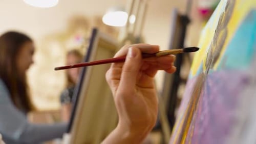 Painting a Vibrant Landscape in a Cozy Studio Setting During the Afternoon