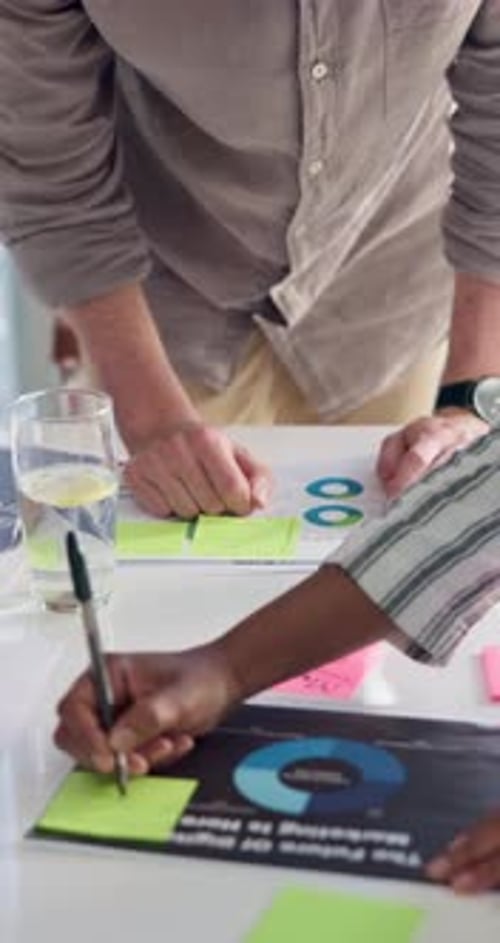 Hands, brainstorming and business people in office, documents and review with sticky note