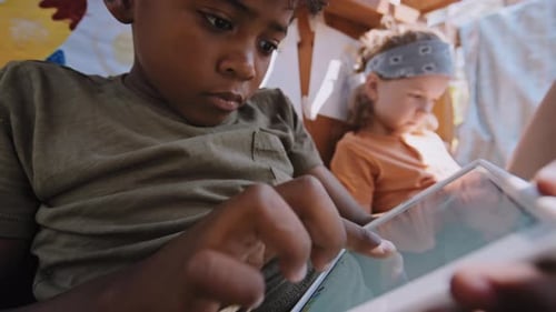 Children Playing Together on Tablets