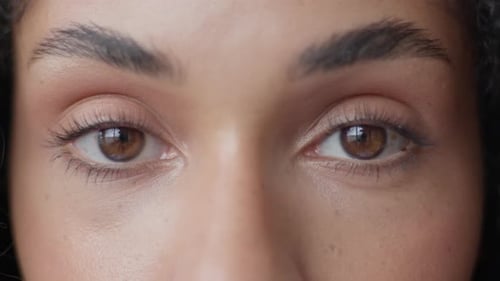 Woman Eyes Open in Slow Motion Extreme Close Up