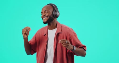 Headphones, happy and black man dancing studio or listening to music, dj or radio podcast