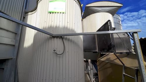 Industrial territory. Exterior of agricultural granary. Grain elevators outdoors