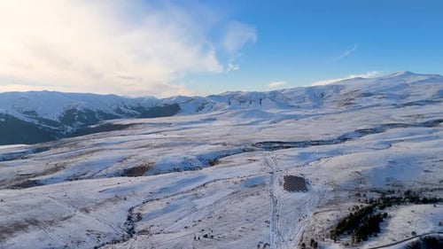 Snow-covered mountains reveal stunning winter landscape in the remote region.