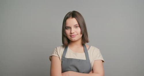 Teen Girl Smiling Wearing Apron