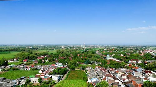 Aerial view from top of local house village with green field