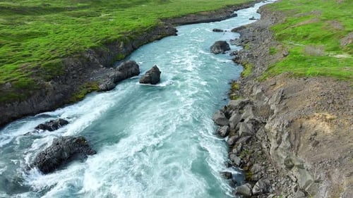 Scenic River in Iceland Summer Landscape with Clear Turquoise Glacier Water