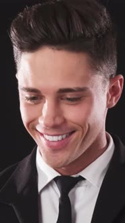 Smiling Man in a Black Suit Portrait