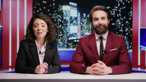 News Anchors Broadcasting in Studio Environment