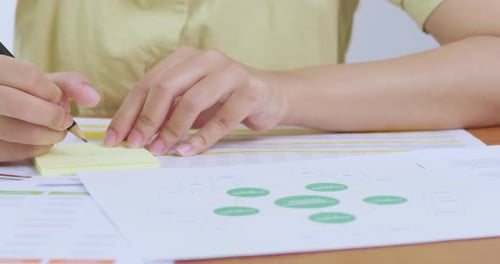 Organizing ideas with sticky notes home office creative process bright environment close-up view