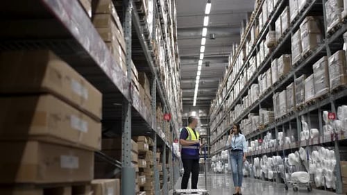 Logistics employee is service customer at warehouse.