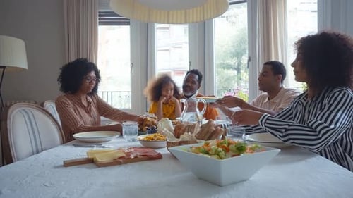 Family and Friends Enjoying Meal at Home