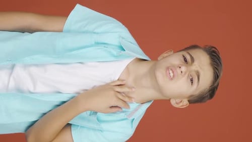 Teenager Displaying Sore Throat Symptoms and Discomfort