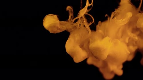 Milk pouring into coffee slow motion.