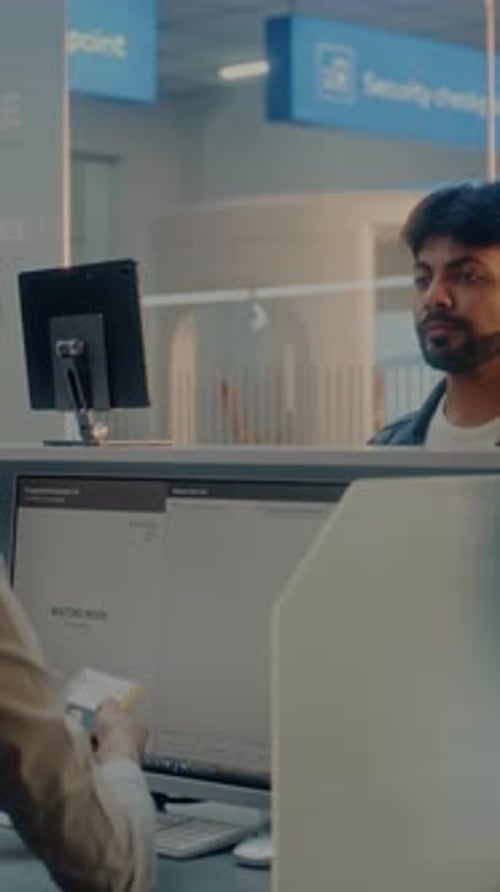 Multiethnic Passengers at Checkin Counter in International Airport Terminal