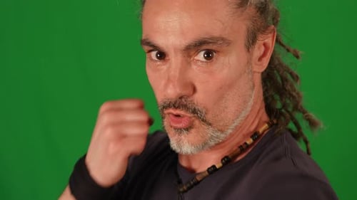 Male Fighter Doing Fight Boxing Practice Training Isolated on Green Screen