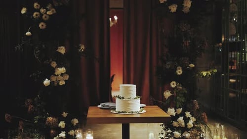 Elegant Wedding Cake Surrounded by White Flowers