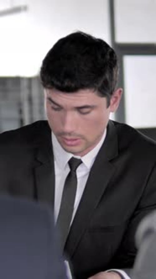 Man in Suit Discussing Business in Modern Office