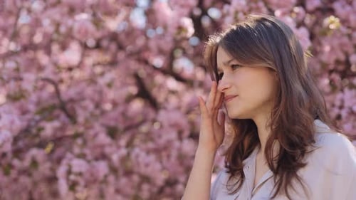 Displeased Woman Rubbing Eyes Because of Allergy to Pollen