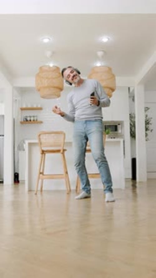Adult Dancing to Music in a Modern Home