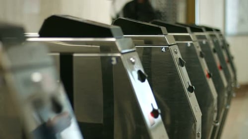 Passengers Pass Through the Turnstile
