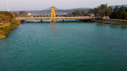 isolated cable bridge over ganges river at evening aerial video is taken at har ki pauri haridwar ut
