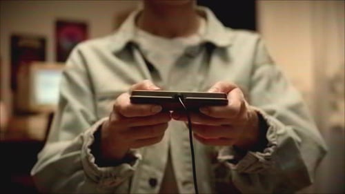 Playing Wired Handheld Video Game