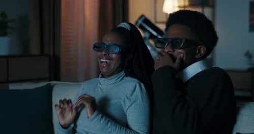 Couple Reacting to 3D Movie at Home