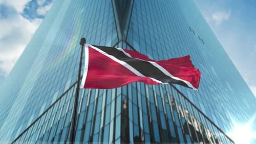 Trinidad and Tobago Flag Waving Against Modern Skyscraper