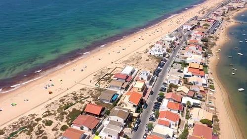 Aerial View of Ocean Coast and Beach Boats on the Water and Tourists Relaxing on Beach As Seen From