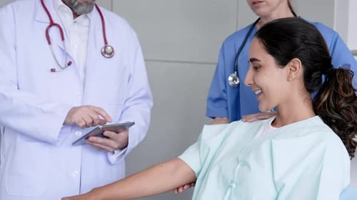 Hispanic woman recovering from broken arm Trying to lift dumbbells To test for injuries Following th