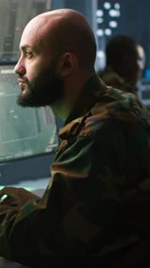Vertical Video Army Soldier Looking at Chroma Key Screens in Command Center