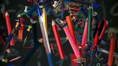 Different School Objects Fly and Fall Against the Background of the Blackboard Filmed on a Highspeed