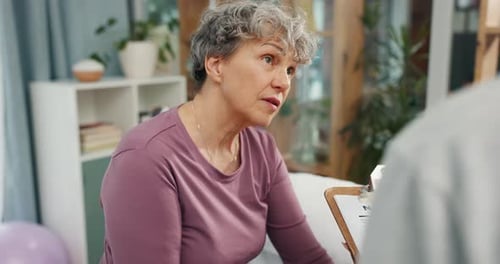 Senior Woman Reads Nutrition Information at Home