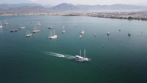 Awesome aerial view of white ship crossing Fethiye Bay, Turkey