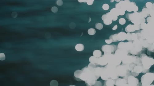 Abstract Sunlight Glittering on Blue Ocean Water