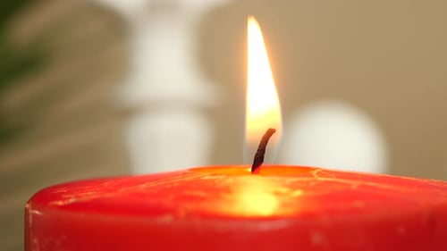 Red Color Candles Slowly Burning Down in Dark