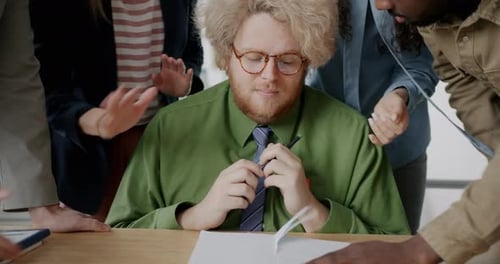 Chubby Young Man Suffering From Abuse and Bullying in Workplace Feeling Unhappy