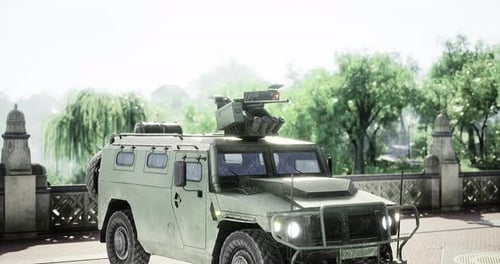 Military Vehicle Parked Under Serene Trees During a Bright Day