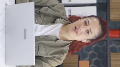 Woman Video Calling on Laptop in Home Office