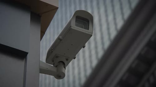 Outdoor Security Camera Mounted Near Modern Building