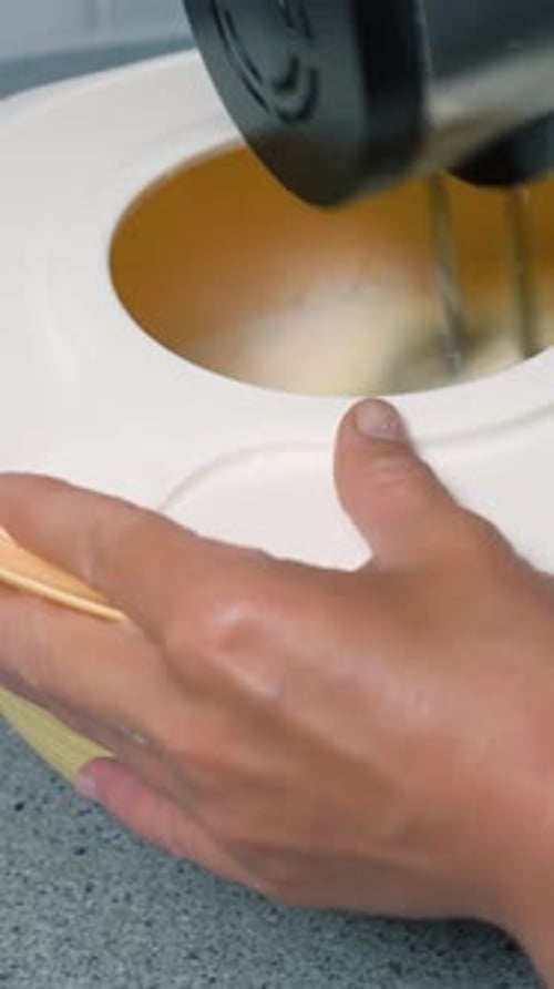 Close Up of Mixer Blending in a Bowl