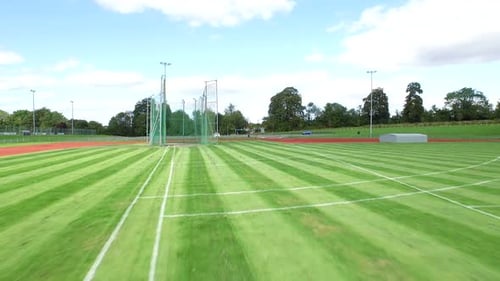 Open Sports Field With Track and Field Equipment