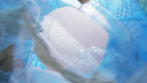 Recycling, Waste Sorting And Sustainability Concept - Hand Throwing Disposable Egg Box Into Trash...
