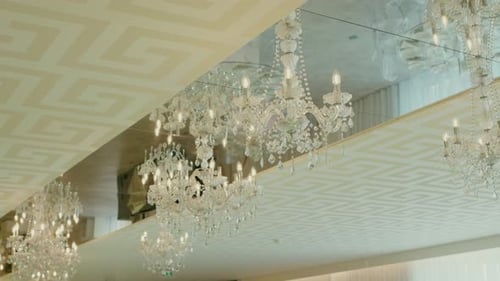 Elegant Chandeliers and Reflected Architecture in Ballroom